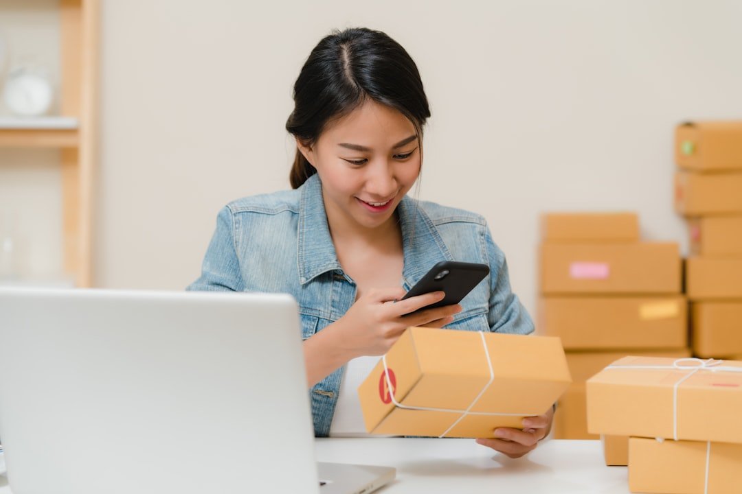 Small e-commerce business owner managing product listings and packaging orders