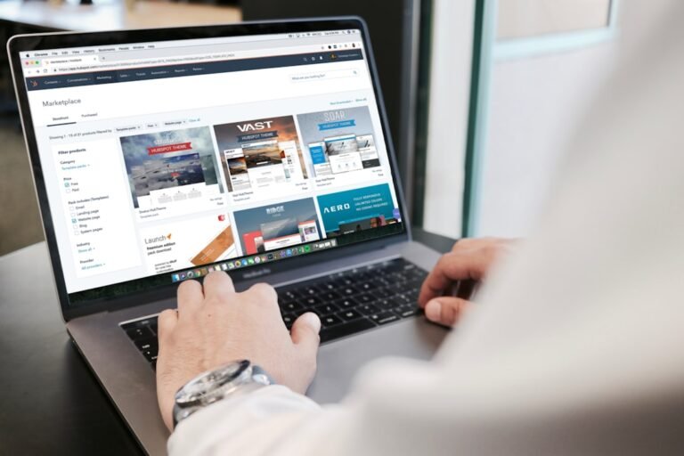 Marketer writing an email marketing sequence using copywriting prompts on a laptop