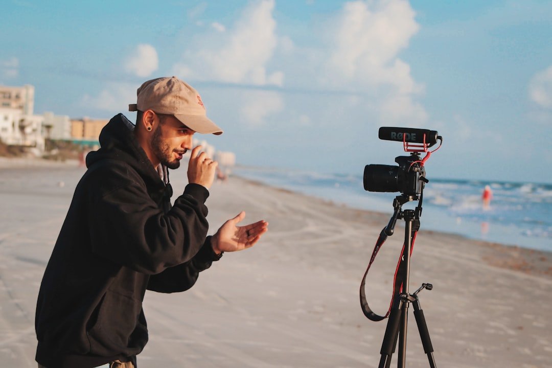 Content creator filming a vertical video using ChatGPT prompts for Instagram Reels scripts